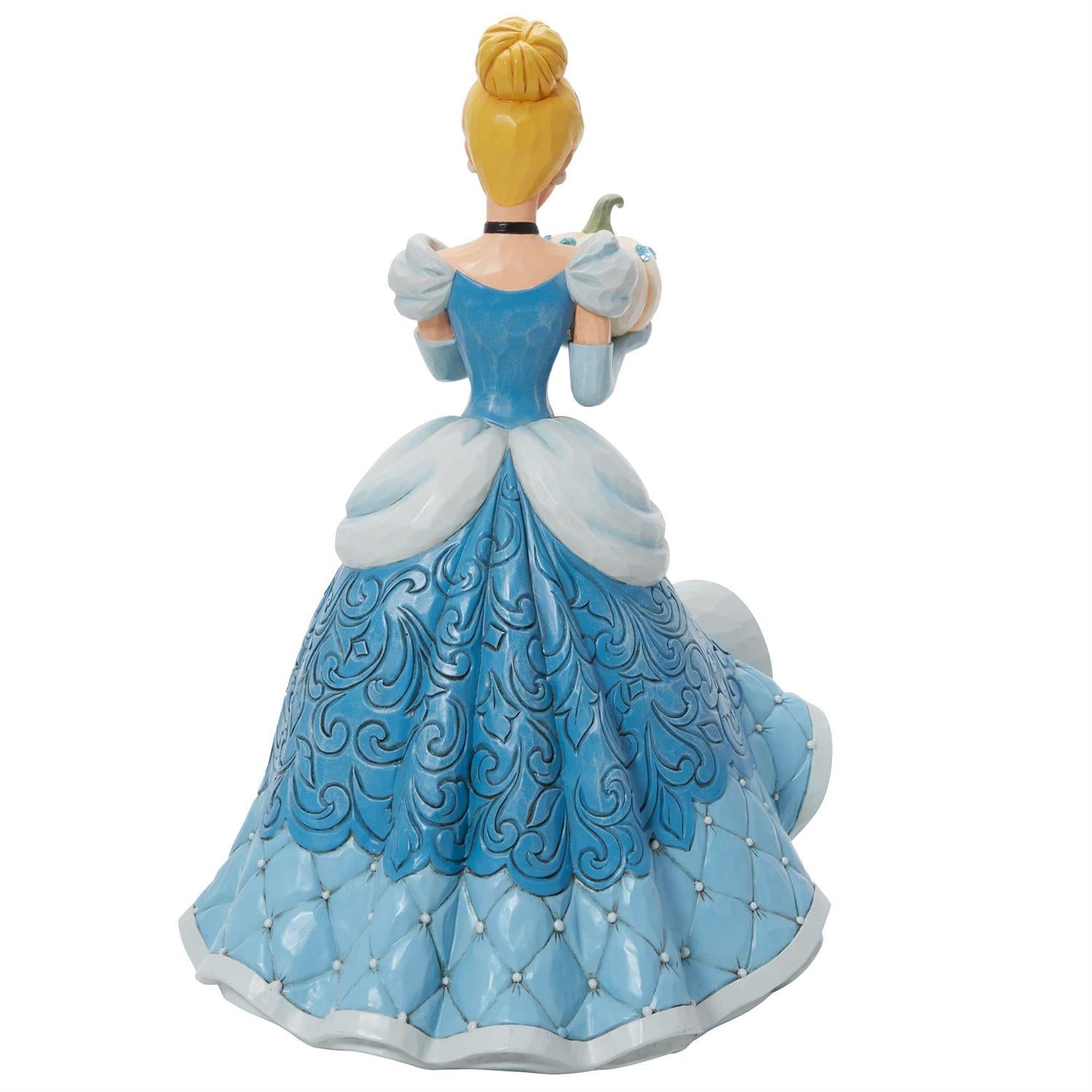 Cinderella holding a pumpkin - back view