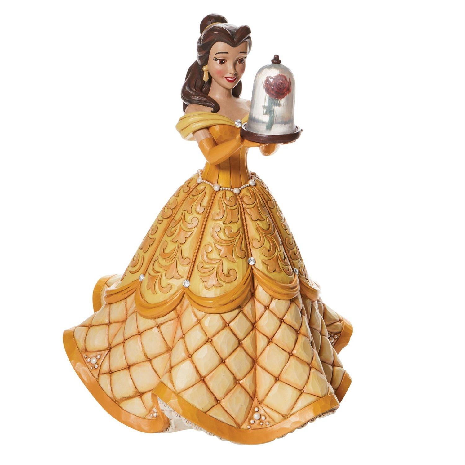 Holding the enchanted rose, Belle looks stunning in her golden ball gown.