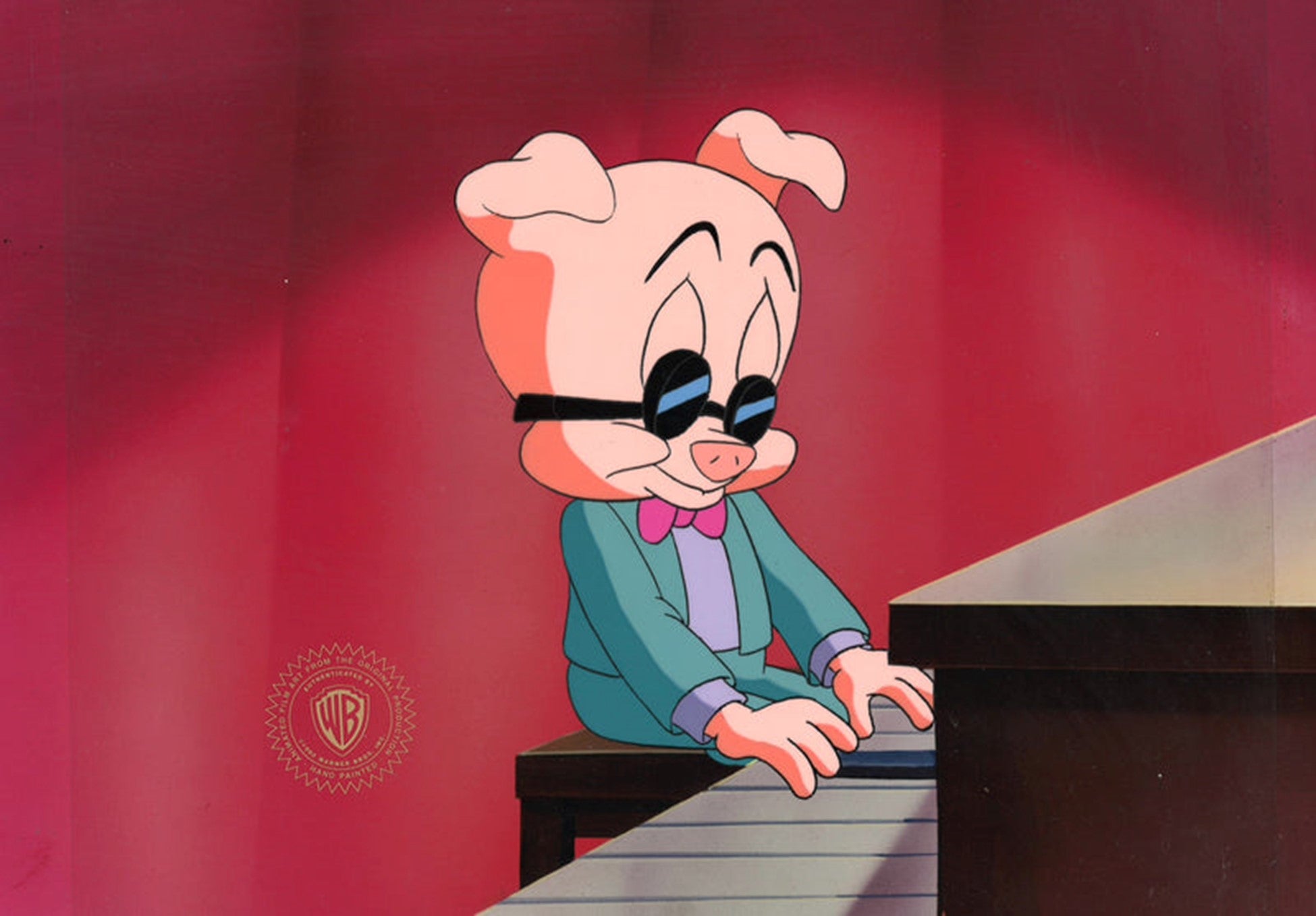 Hamton looks cool wearing his dark sunglasses, as he plays the piano. 