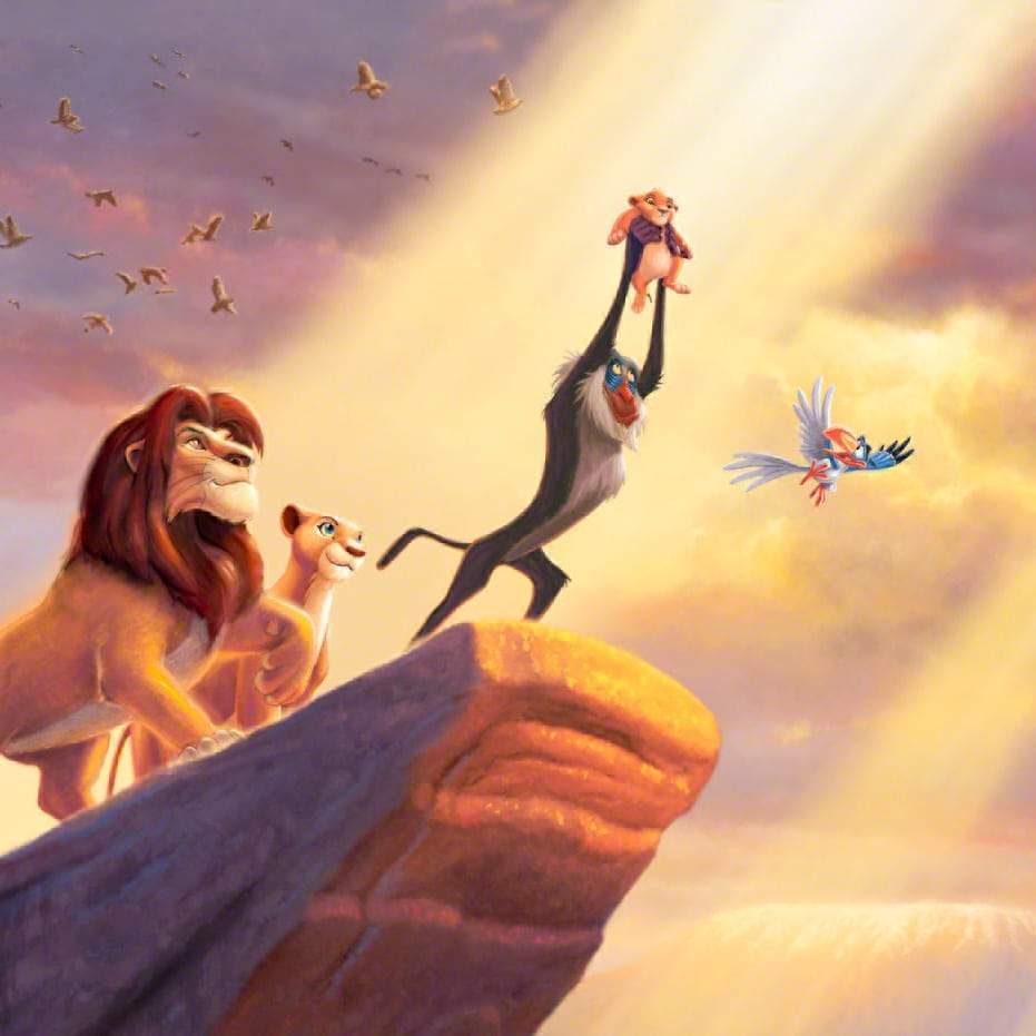 The proud parents Mufasa and Nala watch as Rafiki pays tribute to the new born cub Simba, the future King of the land on the Pride Rock for all the kingdom to see - closeup
