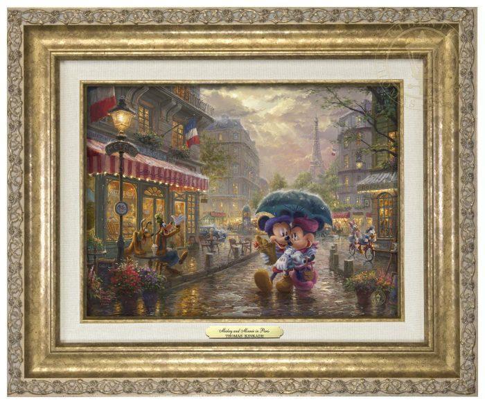 Mickey and Minnie in Paris by Thomas Kinkade Studios. Dressed in traditional French attire, Mickey and Minnie enjoy playing tourist in their berets and striped shirts after spending the morning at the cafe - antique gold frame