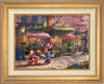 Mickey presents Minnie with a bouquet of flowers and a heart shaped box of chocolate in front of Cafe Bristo - Antique Gold Frame