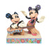  Mickey strums his guitar in a sweet serenade as Minnie