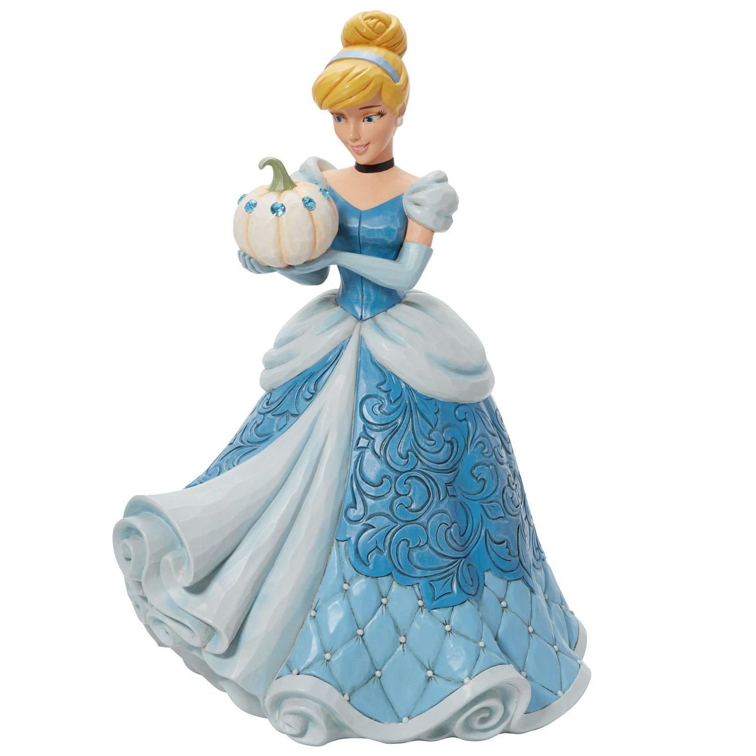 Cinderella holding a pumpkin