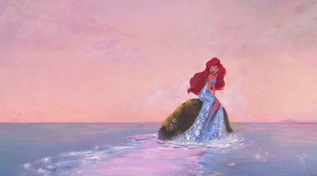 Ariel sits upon a rock, wearing a shimmering silver gem gown.