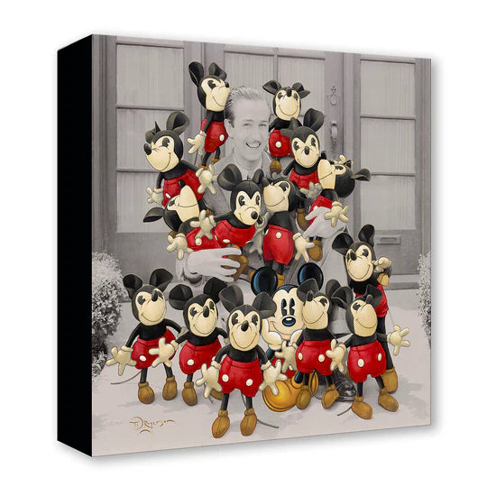Collection of Mickey Mouse figurines in a decorative display box.