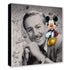 Canvas print featuring a black and white portrait of a famous figure with a cartoon character and Mickey Mouse illustrations.