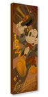 Vintage-style Mickey Mouse poster with top hat and bow tie on a brown background