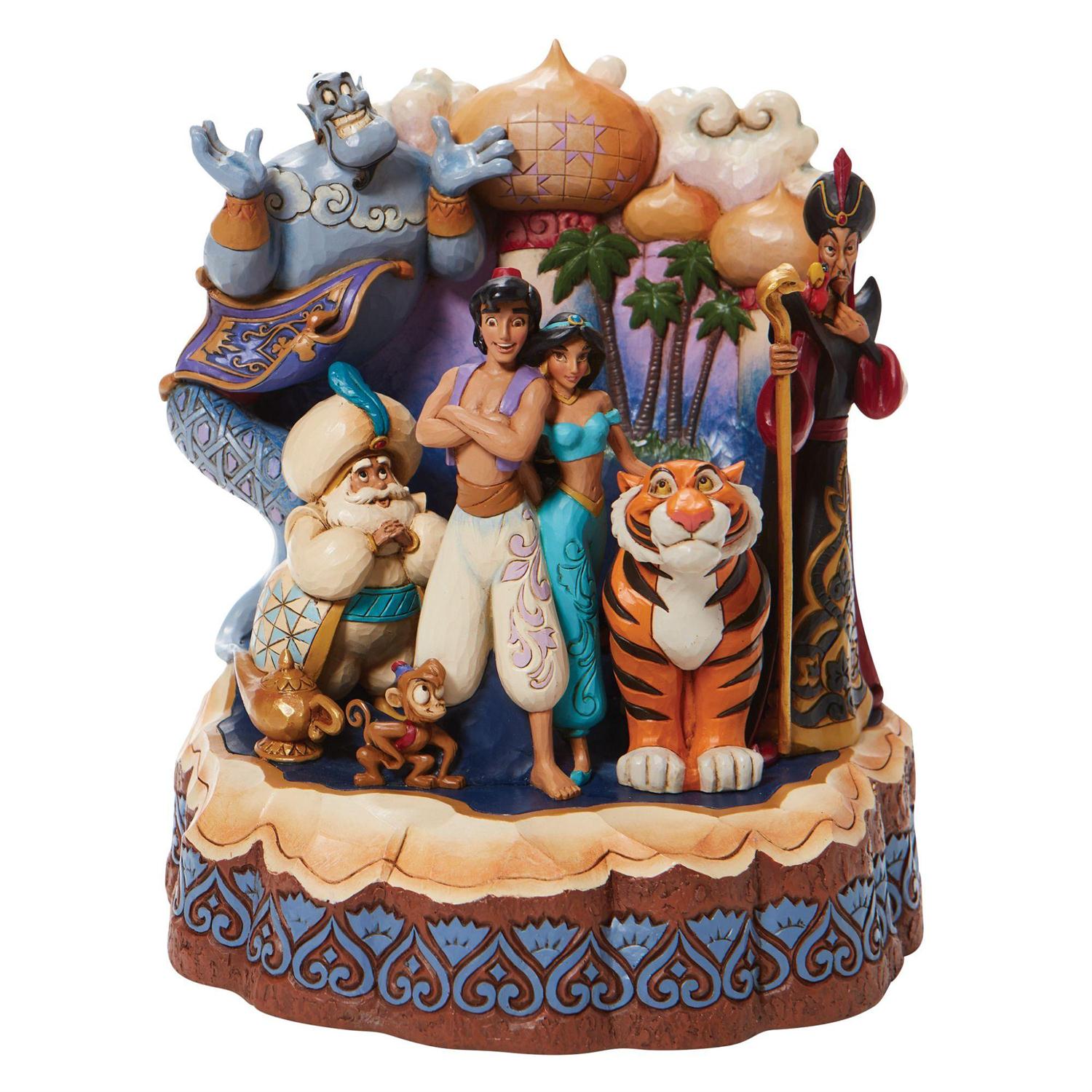Aladdin and Jasmine take center stage as Abu, Rajah, and the Sultan smile close by.