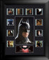 Framed collage of images featuring a character in a dark costume with bat emblem.