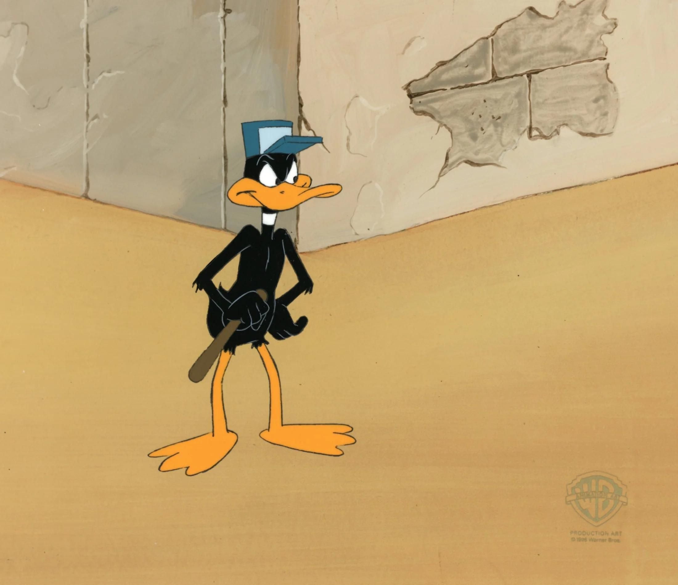 Daffy standing guard holding a wooden baton.stick. 