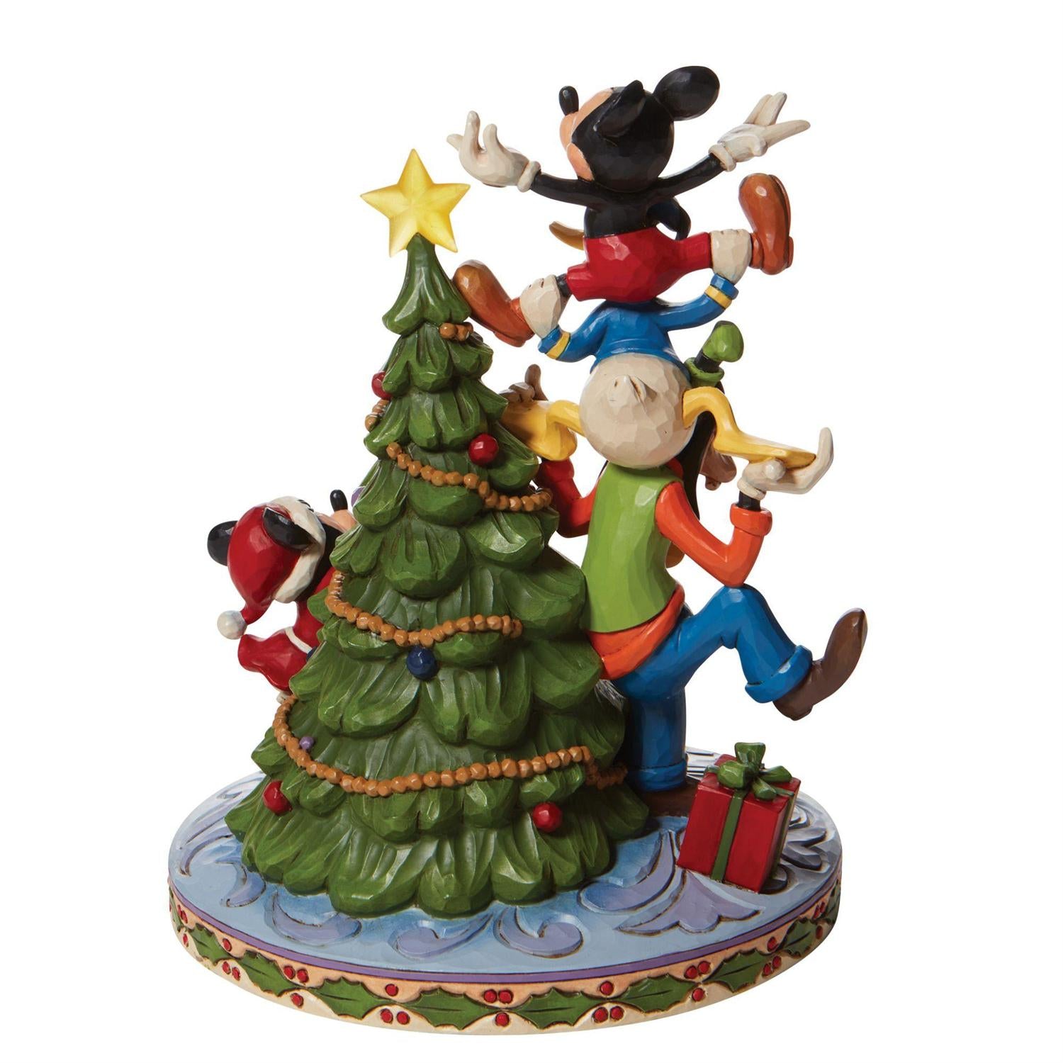 friends form a teetering tower to hoist him to the top of the Mouse family tree - Backview