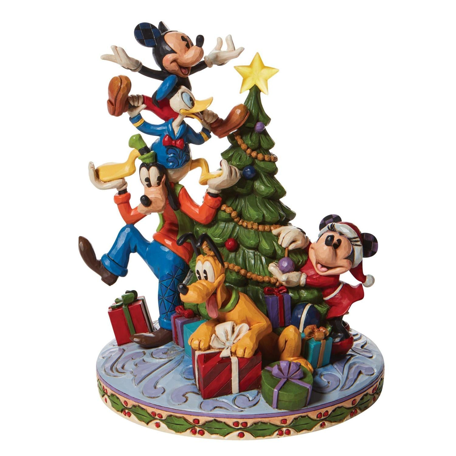 friends form a teetering tower to hoist him to the top of the Mouse family tree - side view