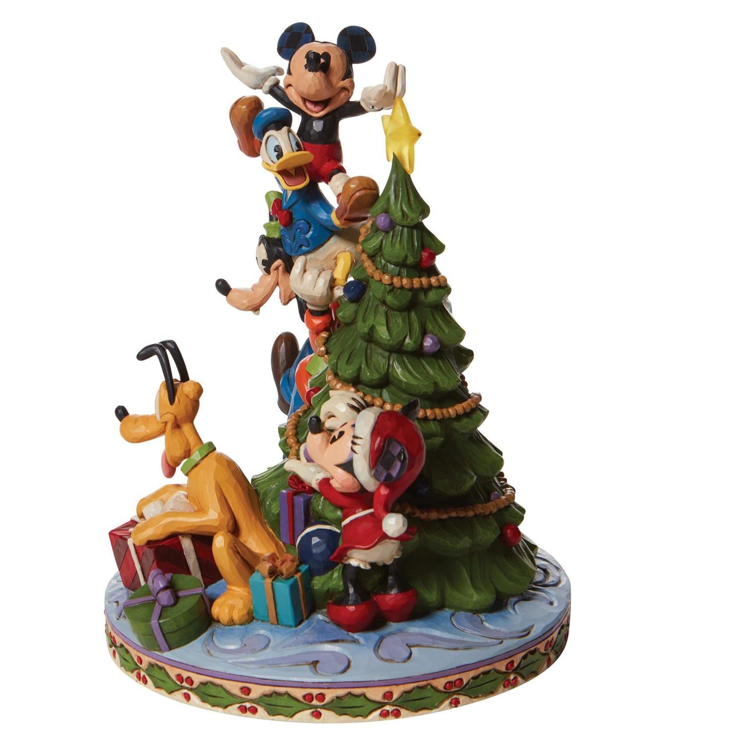friends form a teetering tower to hoist him to the top of the Mouse family tree.
