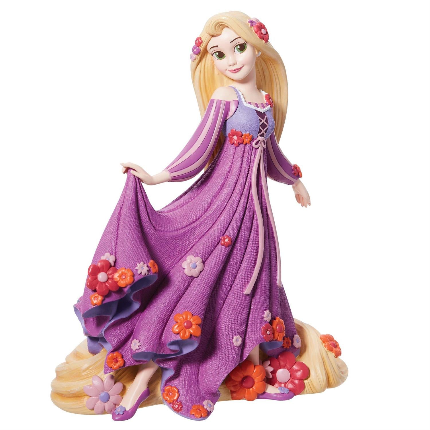 Rapunzel wear her pinkish dress surrounded by dimensional sculpted florals