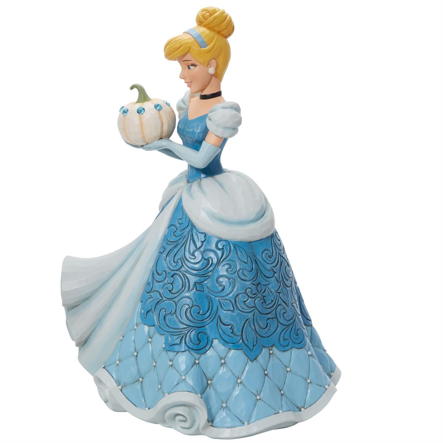 Cinderella holding a pumpkin - side view