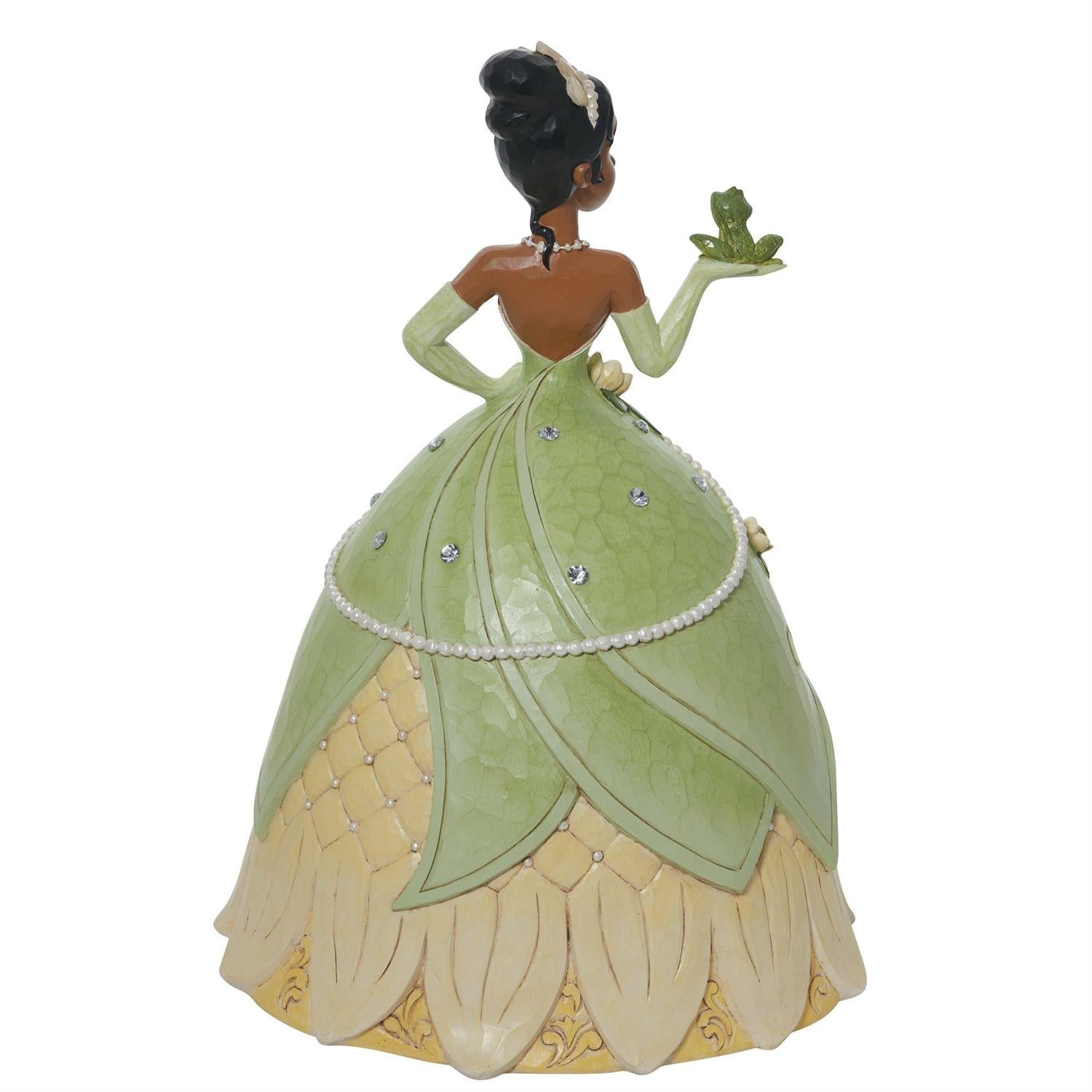Tiana holds her soon-to-be prince, the frog, in a spectacular floral dress and tiara. Backview