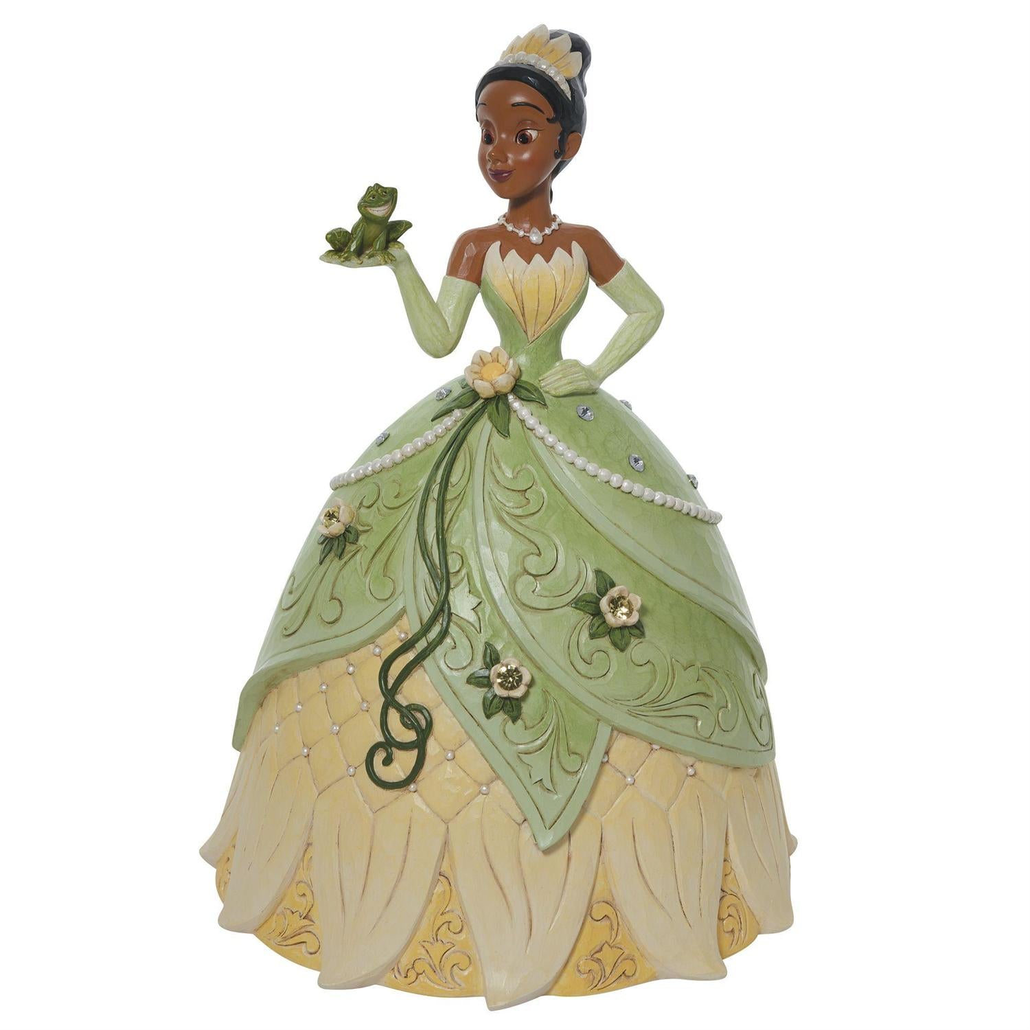 Tiana holds her soon-to-be prince, the frog, in a spectacular floral dress and tiara.