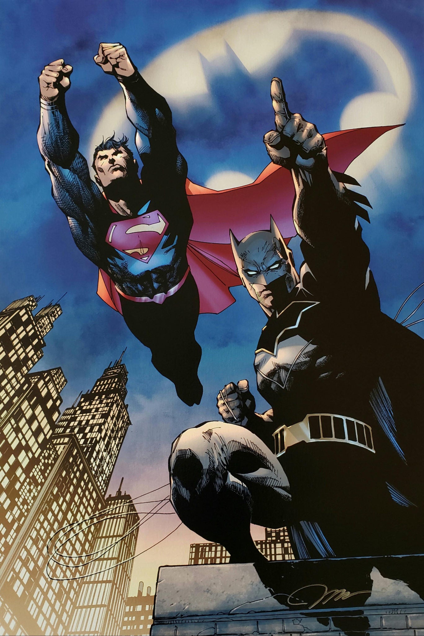 The familiar shape illuminates the sky above city, being the caped crusader's Batman and Superman together again.