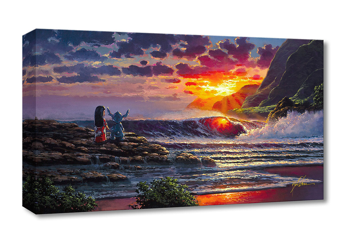 Lilo and Stitch standing at the rocky shoreline watching the sun brighten the sky as it begins to fall into the horizon.