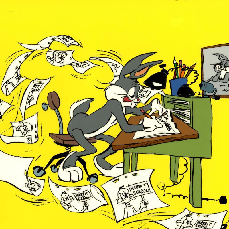 Bugs Bunny hard at work drawing animations at an artist desk with papers flying everywhere.  Closeup