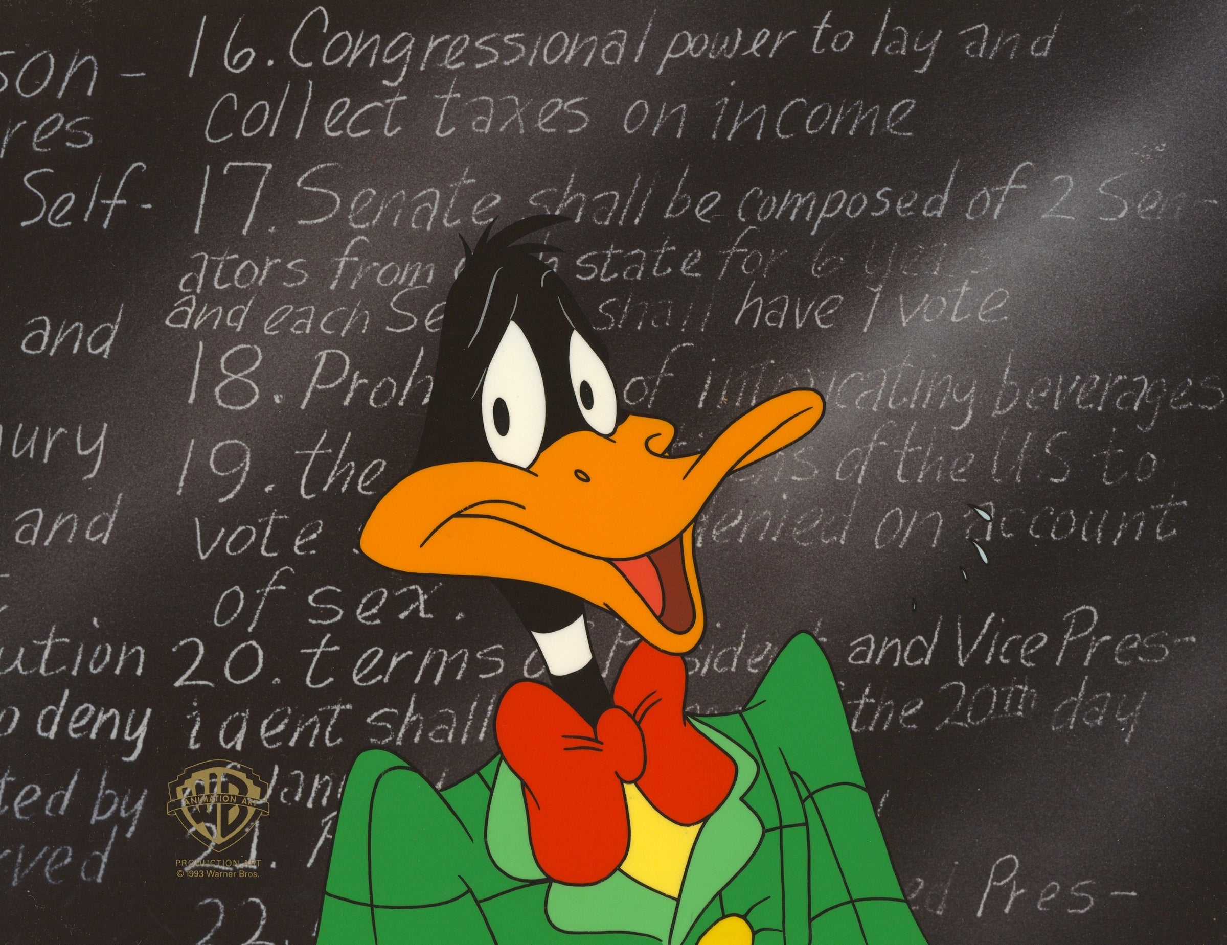 Daffy in front of a black-board, sporting a big red bow tie and a green jacket.  