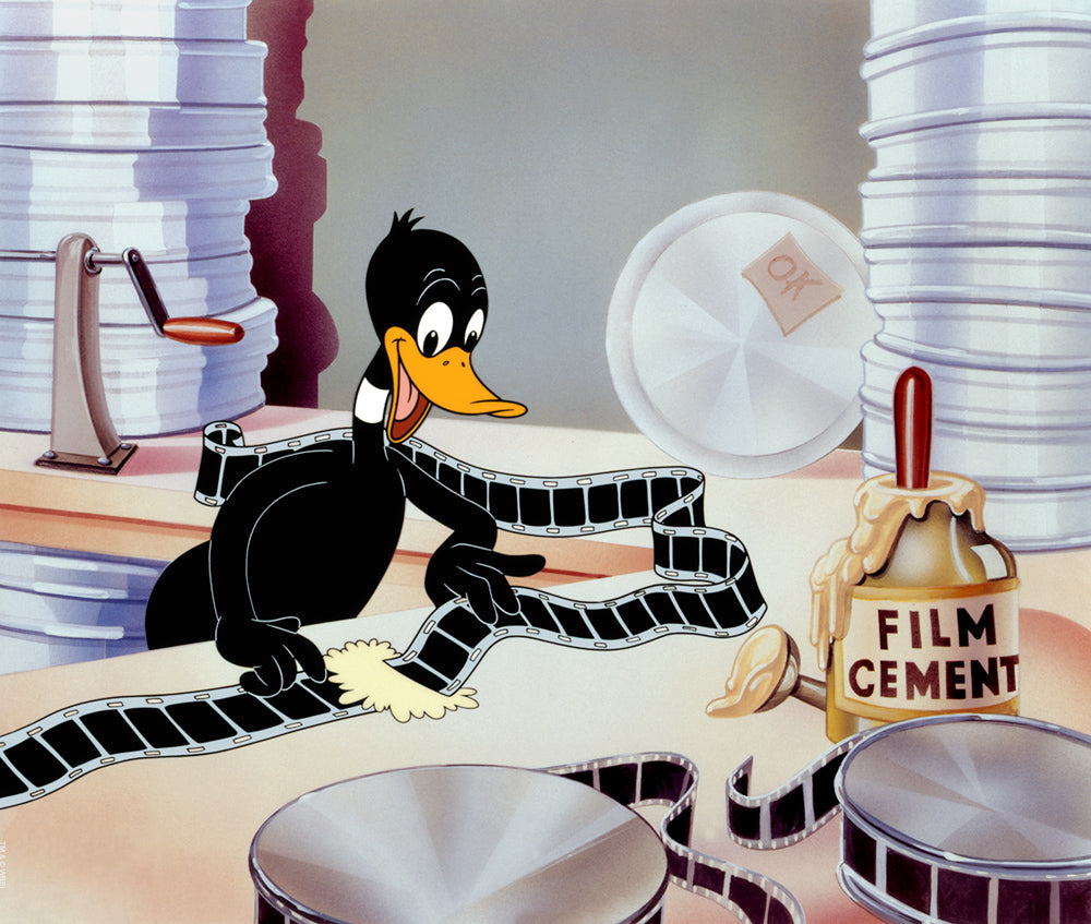 Daffy seen splicing together the movies film in the prodction room..