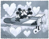 Mickey and Minnie kissing as they fly high into heart-shaped clouds in a vintage airplane.