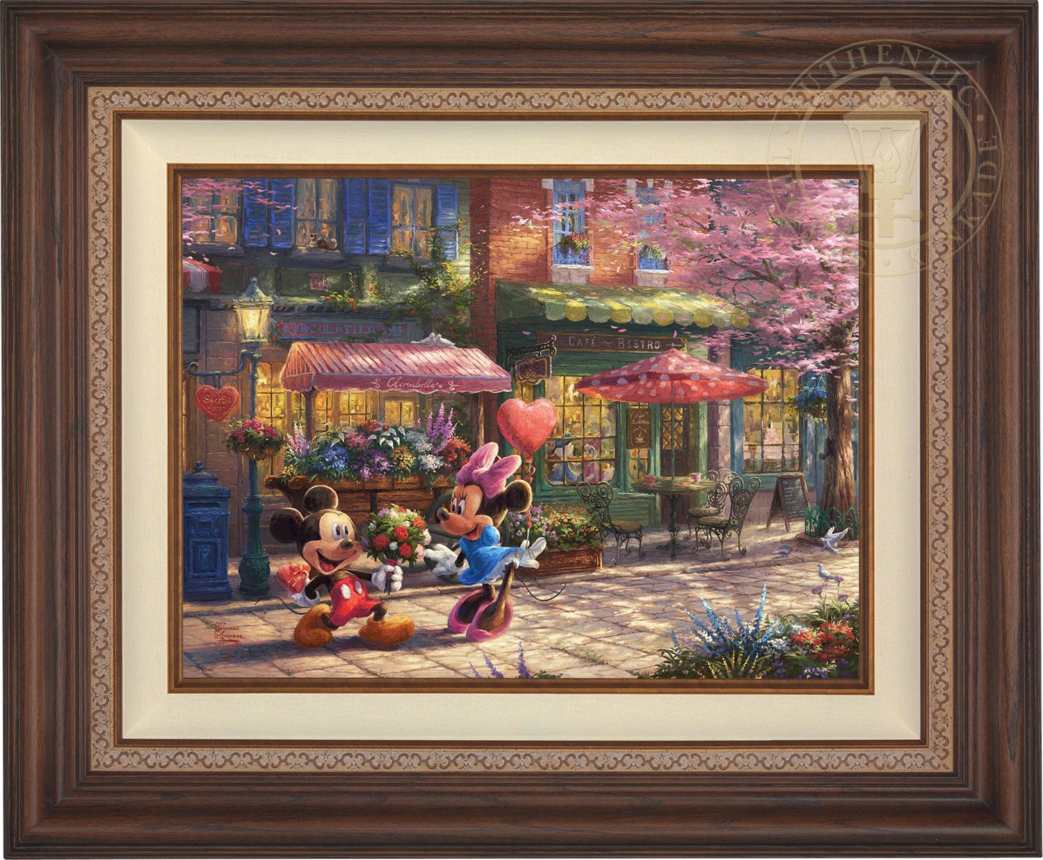 Mickey presents Minnie with a bouquet of flowers and a heart shaped box of chocolate in front of Cafe Bristo - Dark Walnut Frame