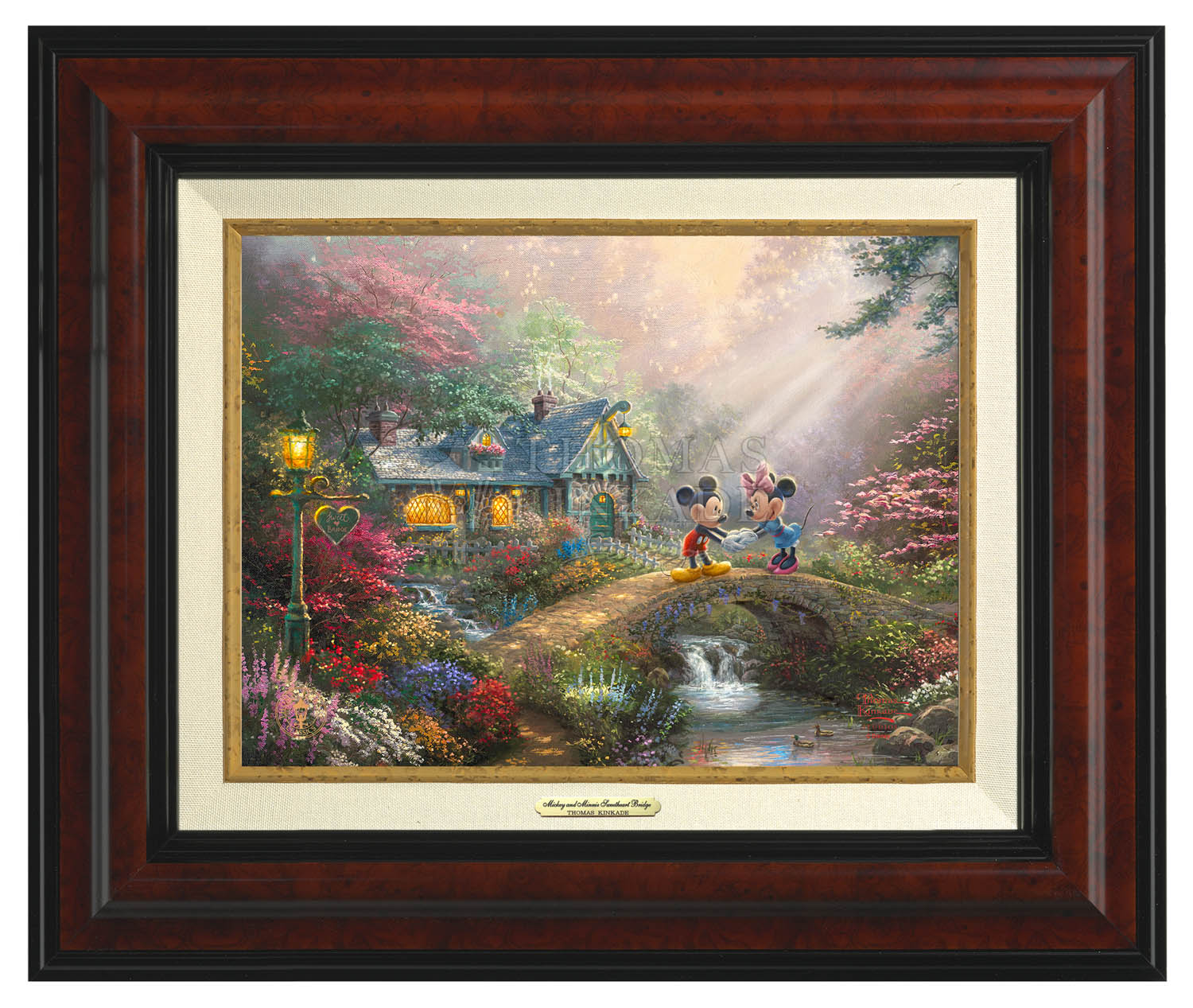Mickey and Minnie join hands on Sweetheart Bridge.  Burl Frame