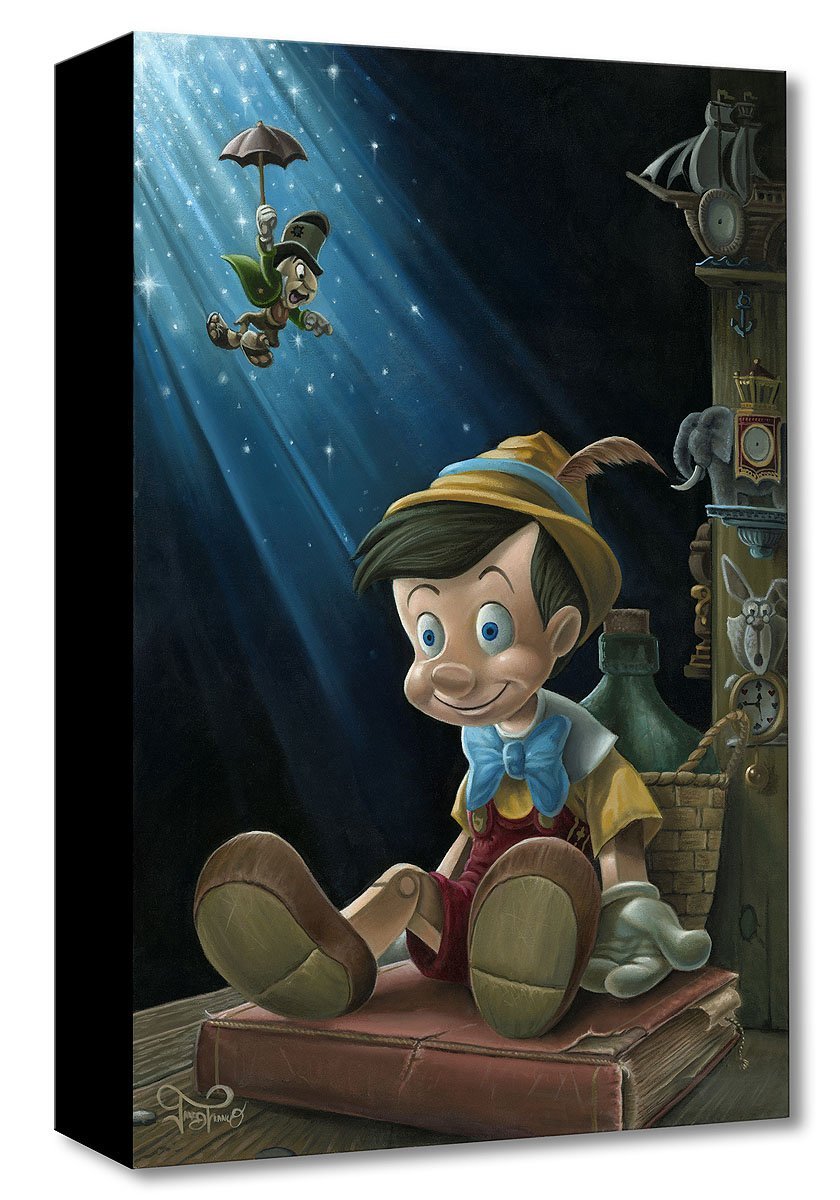 Our little wooden boy (Pinocchio) puppet sitting on a book with Jimmy Cricket sliding down with his red umbrella