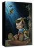 Our little wooden boy (Pinocchio) puppet sitting on a book with Jimmy Cricket sliding down with his red umbrella